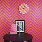 Wandklok met gestreept patroon - oranje/roze - 34x4x34cm
