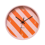 Wandklok met gestreept patroon - oranje/roze - 34x4x34cm