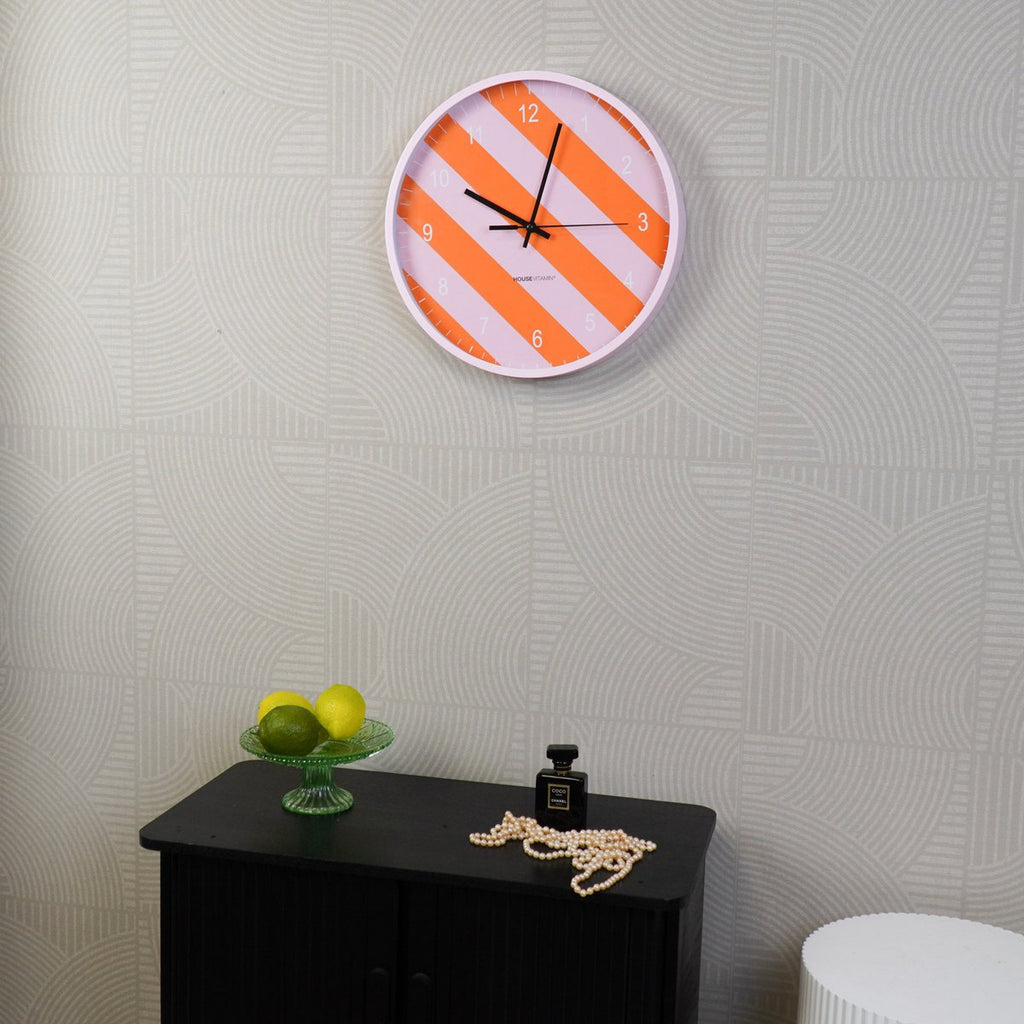 Wandklok met gestreept patroon - oranje/roze - 34x4x34cm